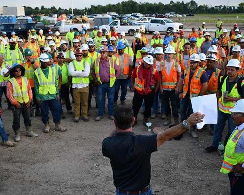 Construction crew meeting in progress